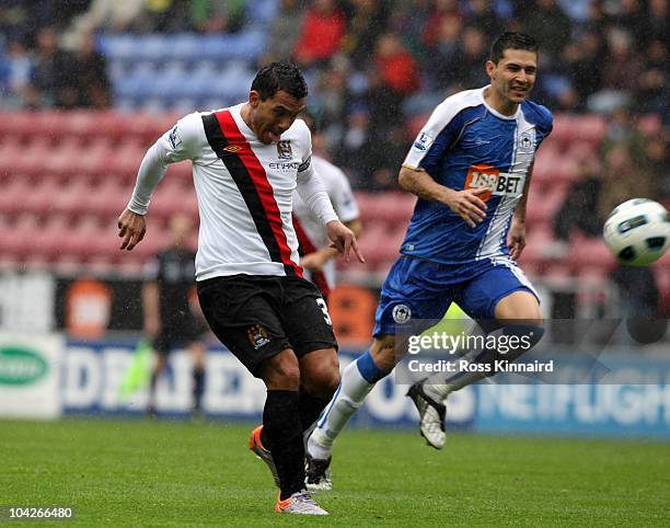 Carlos Tevez of Manchester City scores the opening goal during the Barclays Premiership match between Wigan Athletic and Manchester City at the DW...