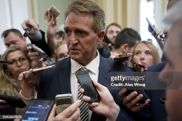 Sen. Jeff Flake speaks to members of the media after a meeting in the office of Senate Majority Leader Sen. Mitch McConnell September 28, 2018 at the...