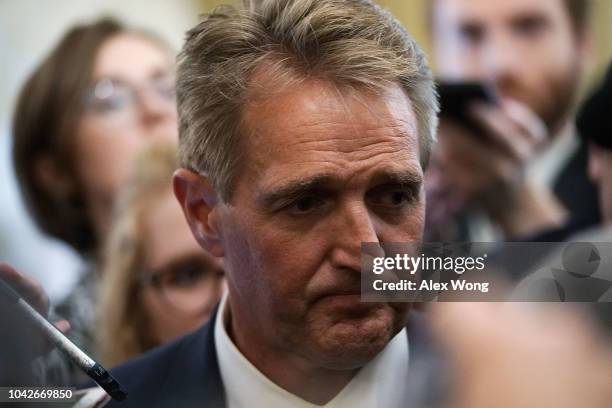 Sen. Jeff Flake speaks to members of the media after a meeting in the office of Senate Majority Leader Sen. Mitch McConnell September 28, 2018 at the...