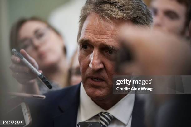 Sen. Jeff Flake speaks to members of the media after a meeting in the office of Senate Majority Leader Sen. Mitch McConnell September 28, 2018 at the...