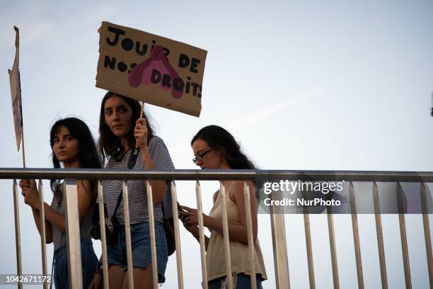 Woman holds a placard reading 'Enjoying our rights'. Women and men took to the streets of Toulouse for the International Safe Abortion Day. They...