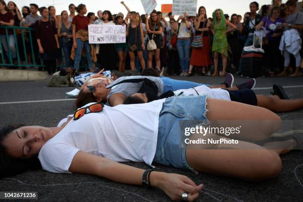 Women performed on the ground to symbolize the dead women due to a failed abortion in Argentina and elsewhere. Women and men took to the streets of...