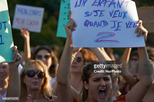 Young woman shouts slogans while holding a placard reading 'A child, if I want and when I want'. Women and men took to the streets of Toulouse for...