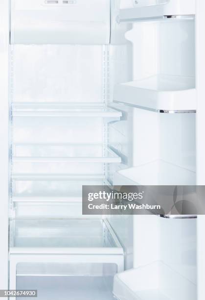 empty, open white refrigerator - open fridge stock-fotos und bilder