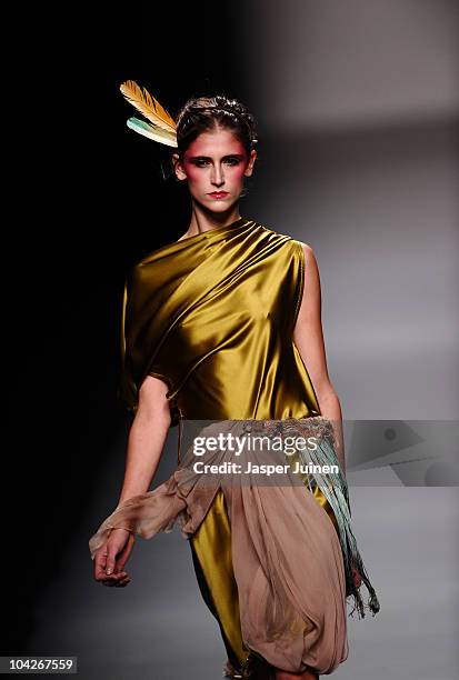 Model walks the runway in the Victorio & Lucchino fashion show during the Cibeles Madrid Fashion Week Spring/Summer 2011 at the Ifema on September...