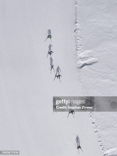aerial view of skiers on snowy slope, st. moritz, switzerland - engadin stockfoto's en -beelden