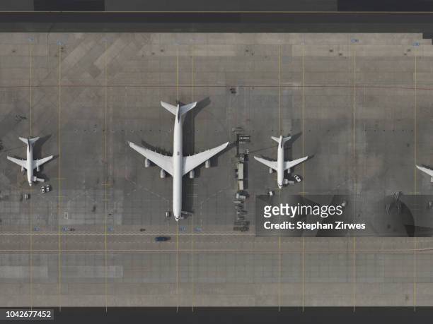 aerial view airplanes parked on tarmac at airport - aeroporto internazionale di francoforte foto e immagini stock