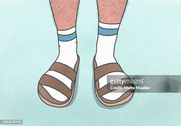 low section man with hairy legs wearing socks and sandals - sandale stock-fotos und bilder