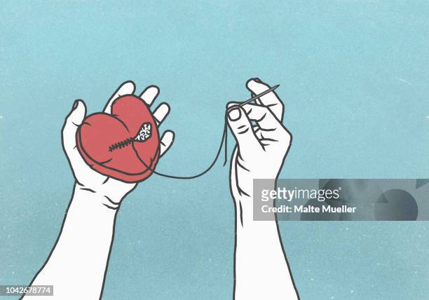 hands sewing broken heart with needle and thread - resilience concept stock pictures, royalty-free photos & images