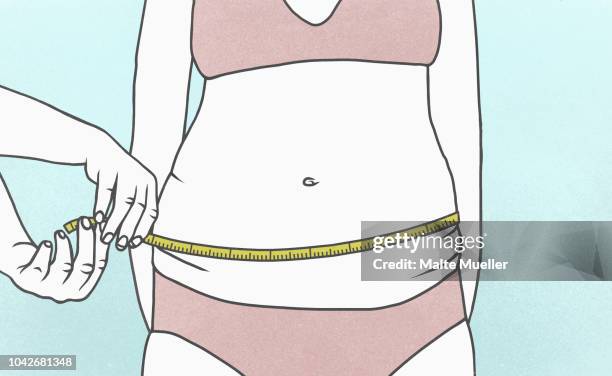 overweight woman measuring waist with tape measure - human build ストックフォトと画像