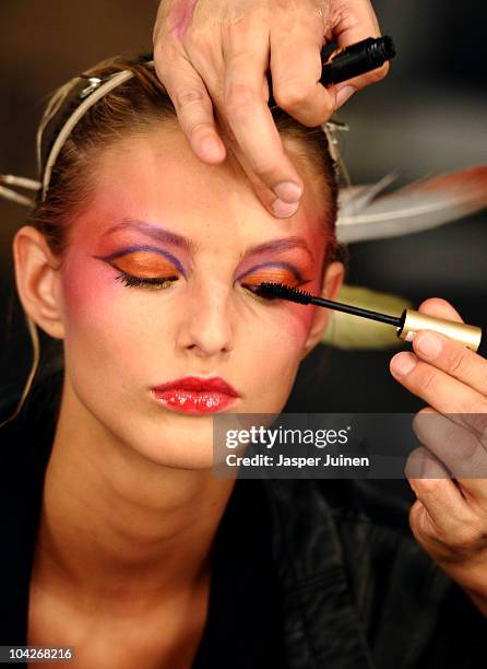 Model gets made up prior to the Victorio & Lucchino fashion show during the Cibeles Madrid Fashion Week Spring/Summer 2011 at the Ifema on September...