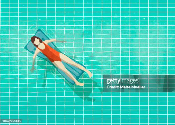 Woman In Inflatable Raft Woman In Bathing Suit Laying On Inflatable Raft In Swimming Pool High ...