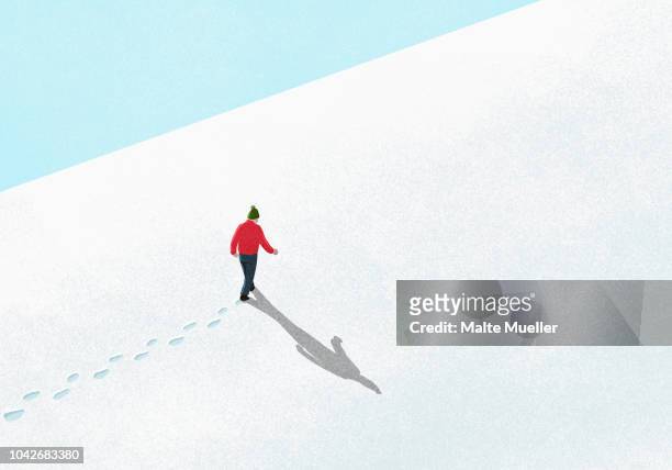 man walking up snowy slope - walking illustration foto e immagini stock