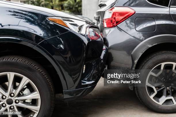 damaged bumpers from car accident - damaged stock-fotos und bilder