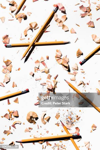 pencils and shavings on white background - pencil shavings stock pictures, royalty-free photos & images