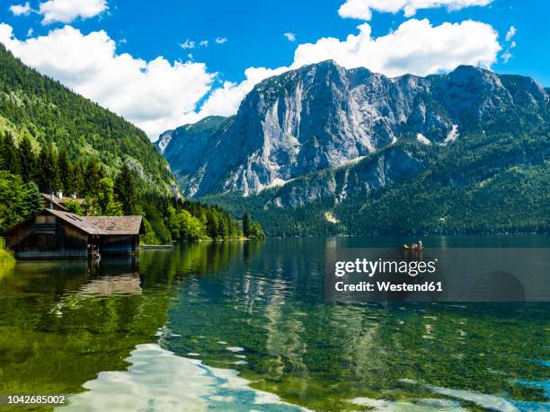 austria, styria, altaussee, boathouse at altausseer see with trisselwand at in the background - styria stock-fotos und bilder