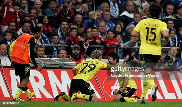 Shinji Kagawa of Dortmund celebrates scoring the first goal during the Bundesliga match between FC Schalke 04 and Borussia Dortmund at Veltins Arena...