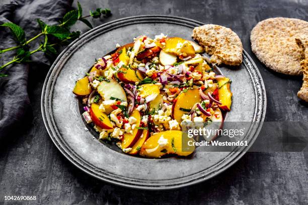 salad with peaches, feta and mint served with pita bread - apple plate stock pictures, royalty-free photos & images