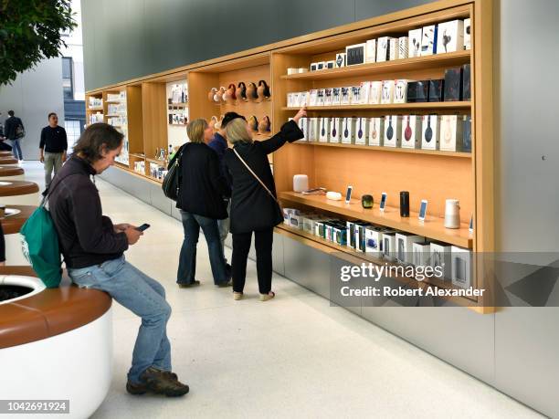 Customers shop for accessories at the Apple Store in San Francisco, California's Union Square.