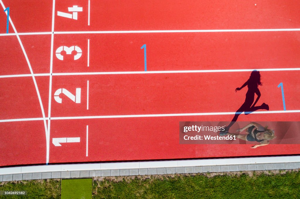 Athletic sports, female sprinter, finish from above