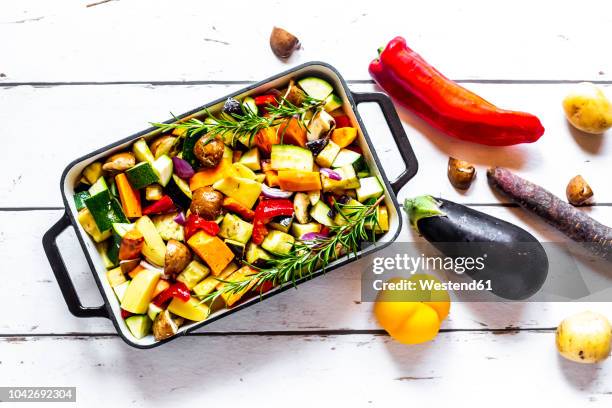 oven vegetables, zucchini, aubergine, potato, carrot, sweet potato, champignon, onion and garlic - casserole bildbanksfoton och bilder