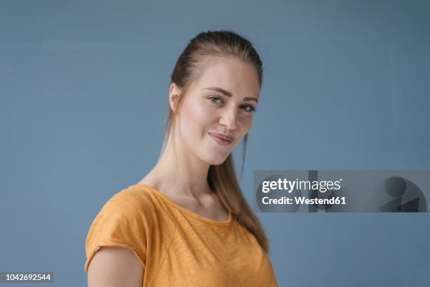 portrait of a pretty woman with a ponytail - mischief woman stock pictures, royalty-free photos & images