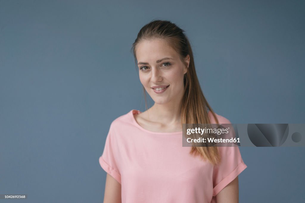 Portrait of a pretty woman, smiling, looking at camera