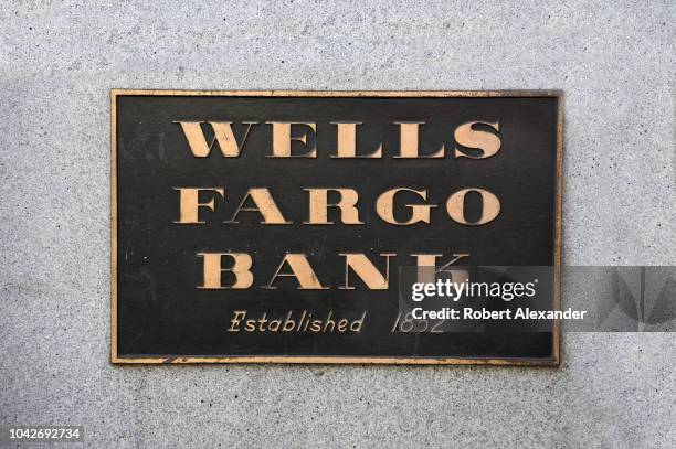 Metal plaque near the entrance to a Wells Fargo Bank in San Francisco, California, located in the historic 1910 Union Trust Company building on...