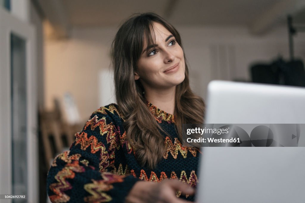 Pretty woman using laptop