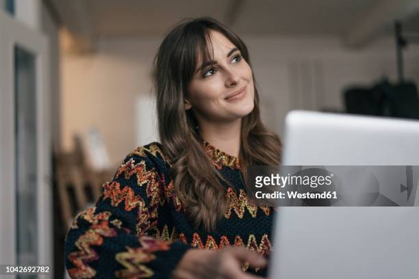 pretty woman using laptop - daydreaming woman bildbanksfoton och bilder