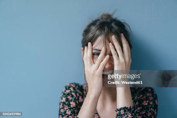 beautiful woman covering face, portrait - disbelief stock pictures, royalty-free photos & images