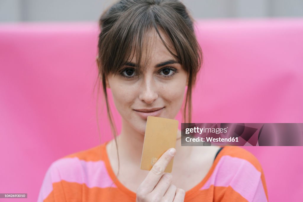 Woman holding credit card