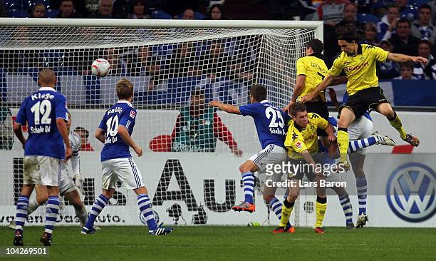 Robert Lewandowski of Dortmund heads the third goal during the Bundesliga match between FC Schalke 04 and Borussia Dortmund at Veltins Arena on...