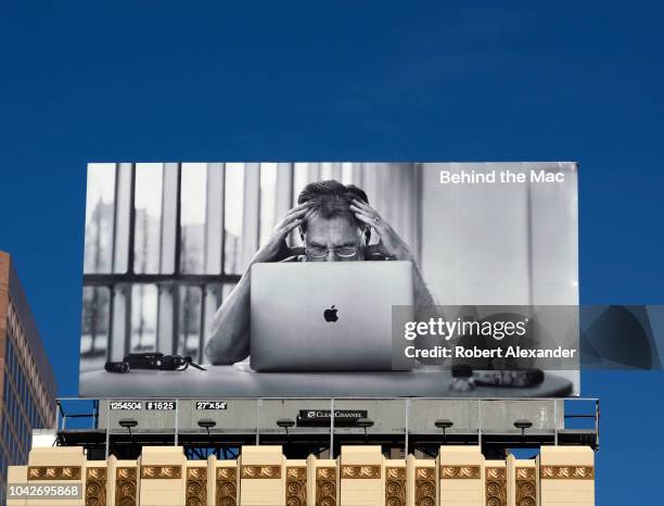 An billboard promoting the Mac, or Macintosh computers, part of Apple Inc.'s 2018 'Behind the Mac' advertising campaign, is mounted on top of a...