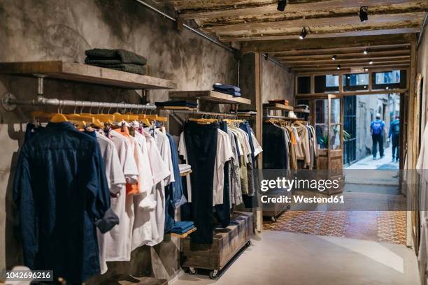 interior of a modern menswear shop - roupa imagens e fotografias de stock