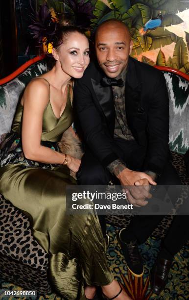 Andrea Rajacic and Thierry Henry attend the Jungle Party at Annabel's on September 28, 2018 in London, England.