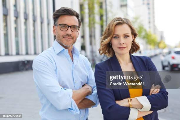 portrait of two business people - business couple stock-fotos und bilder