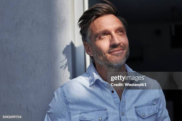 portrait of smiling man at evening twilight - hope stock pictures, royalty-free photos & images