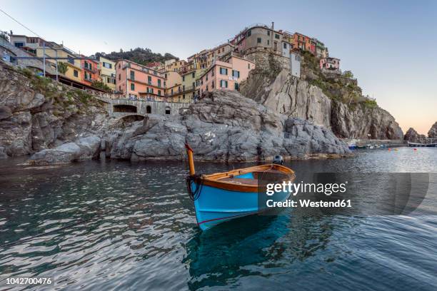 italy, liguria, la spezia, cinque terre national park, manarola, empty blue fishing boat - manarola stock pictures, royalty-free photos & images