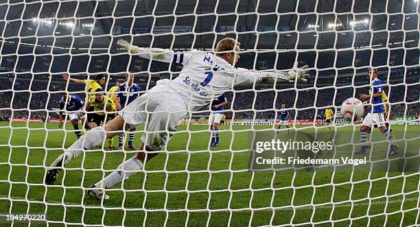 Robert Lewandowski of Dortmund scoring the third goal during the Bundesliga match between FC Schalke 04 and Borussia Dortmund at Veltins Arena on...