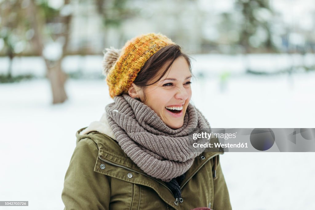 Portrait of laughing woman in the snow