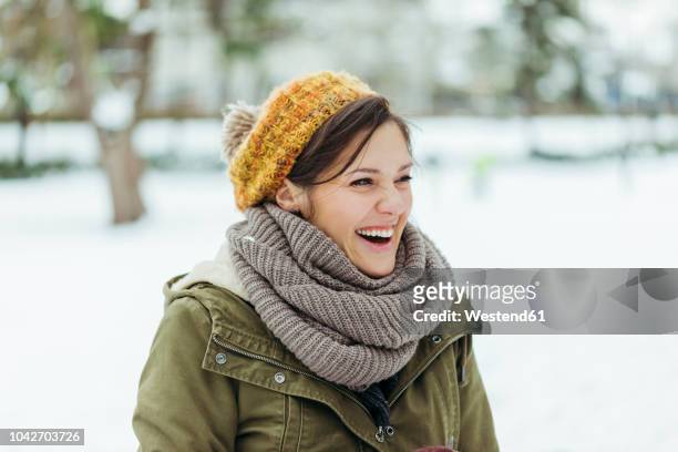 portrait of laughing woman in the snow - nice weather stock pictures, royalty-free photos & images