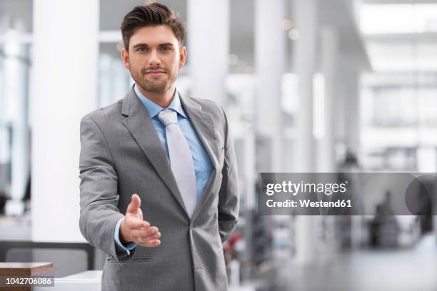 businessman reaching out his hand - traders stock pictures, royalty-free photos & images