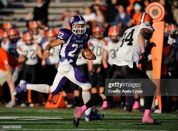 South High School RB, Phillip Lindsay,left, gains a first down against the defense of Robert Condon, Lakewood High School in the third quarter of...