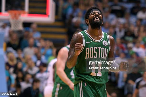 Kyrie Irving of the Boston Celtics reacts after missing a three-point shot as time expired in the first quarter during their game against the...