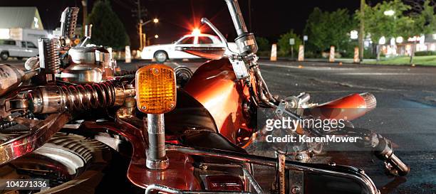 close up photograph of a crashed motorcycle and police car - crash stock pictures, royalty-free photos & images