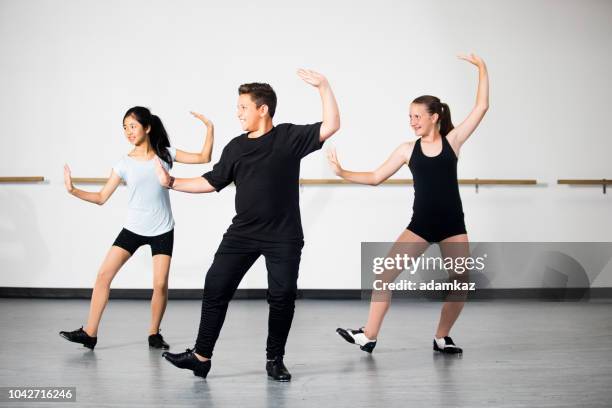 children practicing tap dancing - tap dancing stock pictures, royalty-free photos & images