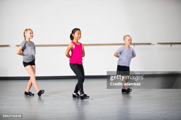 children practicing tap dancing - musical theater stock pictures, royalty-free photos & images