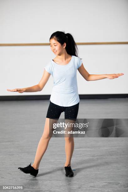 little girl practicing tap dancing - tap dancing stock pictures, royalty-free photos & images