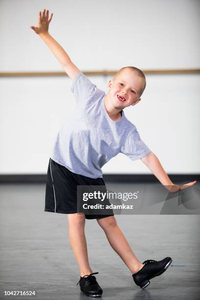 boy practicing tap dancing - tap dancing stock pictures, royalty-free photos & images